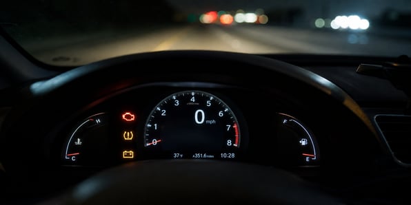 car-dashboard-with-lights-on